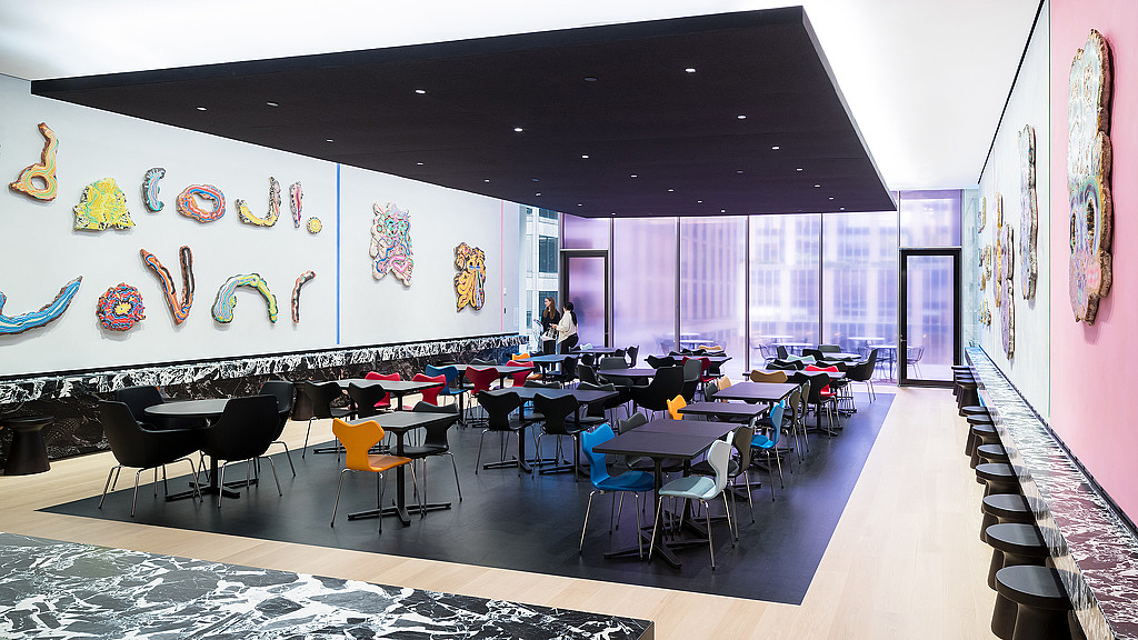 A room with tables and chairs.